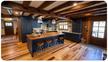 Rustic mountain kitchen with wood beams and butcher block island — ALPO Services